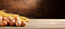Eggs With Ears Of Wheat On Wooden Table