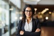 Leinwandbild Motiv Hispanic smiling toothy Latino Indian successful confident Arabian businesswoman worker lady boss female leader girl business woman posing crossed hands looking at camera in office corporate portrait