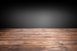 Fototapeta Sawanna - Wooden floor brown texture with black wall and black background. High quality photo