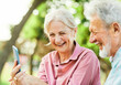 © Lumos sp - woman man senior couple together elderly smartphone online communication cellphone mobile phone using device active happy park internet connection technology wireless texting