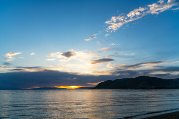 Wall Mural - beautiful bright sunset over the lake and mountains