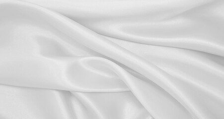 Wall Mural - Smooth elegant white silk or satin luxury cloth texture as wedding background. Luxurious Christmas background or New Year background design