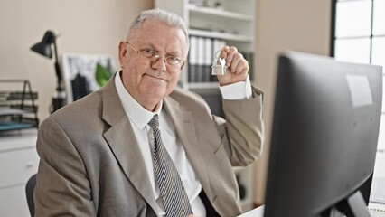 Poster - Middle age grey-haired man real state agent holding keys of new home at office