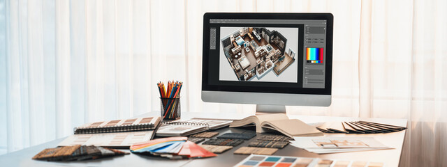 Interior designer workspace table and architecture software on laptop screen with mood board materials and colorful swatch color for color selection. Modern interior design office. Insight