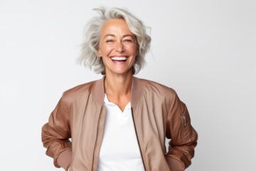 Wall Mural - Portrait of a smiling senior woman with short grey hair isolated on a white background