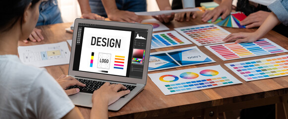 Aufkleber - Graphic designer brainstorming logo and graphic art at busy artistic workshop, laptop display workspace. Experimenting color palette and pattern for creative design. Panorama shot. Scrutinize