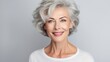 © ds17 - Beautiful smiling mature woman with short gray hair, on a light background. AI generation