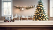 Wood dining table with copy space and christmas tree in the background