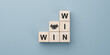 Win win wording with hand shaking icon on wooden cube block. win-win in business concept for success and business deal situation concept. copy space