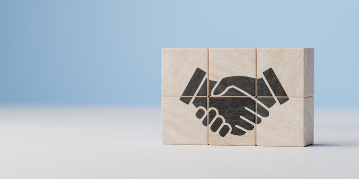 Wall Mural -  - Handshaking icon on wood cube block. teamwork, brainstorming, cooperation business deal and agreement, and business success concept. copy space
