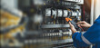 © A Stockphoto - Electrician measurements with multimeter testing current electric in control panel, safety concept .