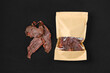 Overhead view of dried beef jerky meat in paper package