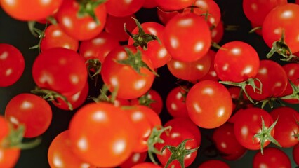 Aufkleber - Super Slow Motion of Cherry Tomatoes Flying on Black Background. Filmed on High Speed Cinema Camera, 1000 fps. Camera Placed on High Speed Cine Bot, Tracking the Target.