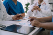 © NINENII - Doctor working in hospital use calculator, Healthcare and medical concept.