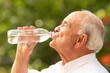 © carballo - senior man in summer drinking water