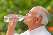 © carballo - senior man in summer drinking water