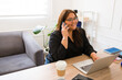 Cheerful businesswoman having a business call