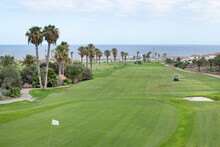 Popular 18-hole Golf Course Nested In The Tranquil Holiday Resort Displaying Superb Views Towards The Atlantic And Nearby Small Marina In Amarilla Golf, Tenerife, Canary Islands, Spain