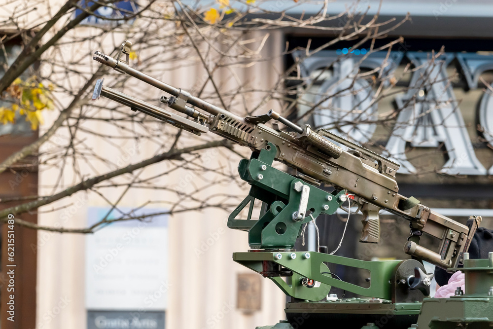 Machine gun mounted on top of a military vehicle, object closeup, detail nobody no people War, city warfare, town combat, conflict. Professional army equipment, heavy guns, protection, attack, defense