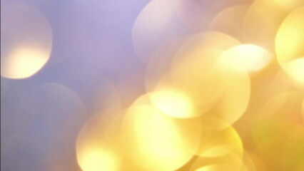 Wall Mural - Gold bokeh abstract moving background. Golden blurred bokeh move, shine and shimmer with light leaks. Natural defocused effect. Background, overlay or transition for compositing footages in 4K.