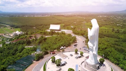 Wall Mural - Aerial view of Our lady of Lourdes Virgin Mary catholic religious statue on a Nui Cui mountain in Dong Nai province, Vietnam.