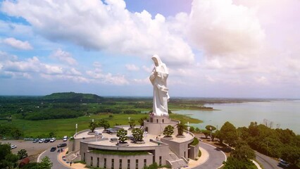 Wall Mural - Aerial view of Our lady of Lourdes Virgin Mary catholic religious statue on a Nui Cui mountain in Dong Nai province, Vietnam.