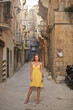 © olly - young beautiful woman on a street in valletta, malta