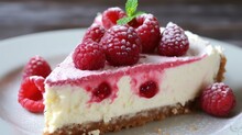 A Piece Of Cheesecake With Raspberries On Top