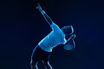 padel tennis player. padel open tour. man athlete with paddle tenis racket on blue background. sport