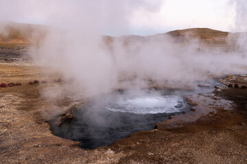 Exploring the fascinating geothermic fields of El Tatio with its steaming geysers and hot pools high up in the Atacama desert in Chile, South America
