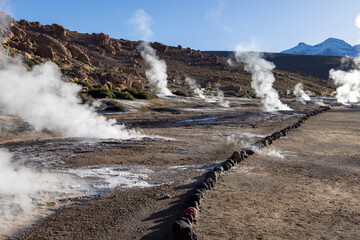 Exploring the fascinating geothermic fields of El Tatio with its steaming geysers and hot pools high up in the Atacama desert in Chile, South America