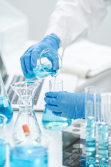 medicine research in chemical laboratory, chemist scientist working with liquid experiment test analysis by using scientific tube beaker glassware, chemistry science pharmaceutical medical lab concept