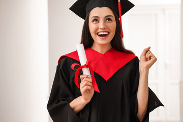 Sticker - Female graduate student with diploma in hall