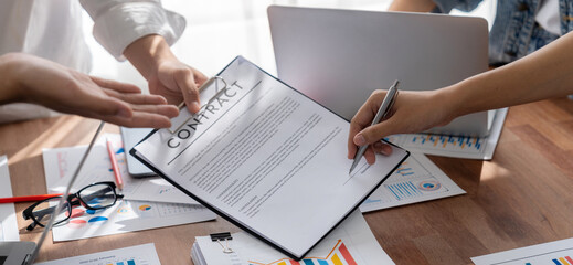 Poster - Panorama shot hand signing signature on legal contract, business report and BI Fintech paper on table. Seal business agreement deal with signature. Investment loan for startup company. Scrutinize
