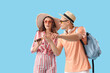 © Pixel-Shot - Young couple with spyglass and compass on blue background