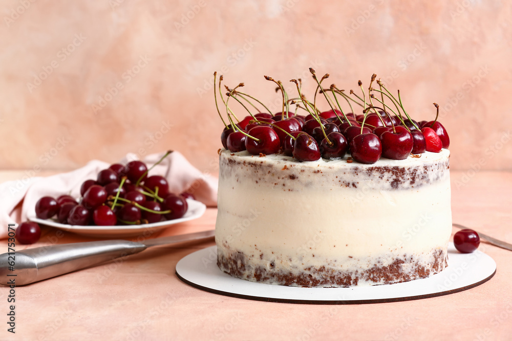 Tasty cherry cake on table