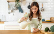 © Art_Photo - Portrait of beauty healthy asian woman smiling and having protein breakfast drinking and hold glasses of milk of fresh milk, nutrition,calcium and vitamin,dairy product in kitchen at home.Diet concept