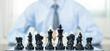 hand of businessmen moving chess in competition shows leadership, followers, and business success strategies