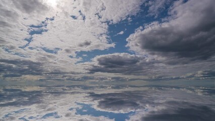Wall Mural - Water surface in Ultra HD 4K, Loop Footage - View against the sky. sky with evening sky clouds over the sea. Small smooth waves and water reflection