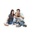 © kromkrathog - Happy asian family of father, mother and daughter using smart phone on floor, full body isolated on background