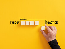Transition Of Theory Into Practice. Implementation Of Theories In Practice. Hand Places A Wooden Cube To The Loading Bar With The Words Theory And Practice.