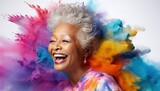 Fototapeta Tęcza - Happy black old woman smiling in a cloud of colorful smoke, color explosion, holi, age-positivity, against ageism, having fun, over 50, colors, party, peace, inclusive, freedom. Generative AI.