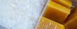 Hot melt adhesive in food labeling and packaging. Thermoplastic polymers. Non toxic hot melt glue block and hot melt adhesive pastilles or pellets. Chemical business industry. Packaging solutions.