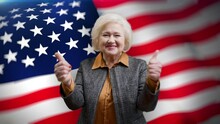 Portrait Of Joyful Senior Woman Gesturing Thumbs Up Against U.S. Flag, Patriot