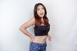 Diet lifestyle concept. Shocked Asian girl measuring her waist with measuring tape, isolated by white background