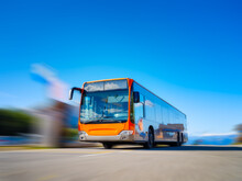 Picture Of A Bus In Motion. City Transport. Transportation For Transporting People. Blurred Background. Photo For Background And Wallpaper.