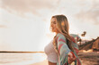 © Daniel - Portrait of one young woman at the beach looking at the sea enjoying free time and freedom outdoors. Having fun relaxing and living happy moments..