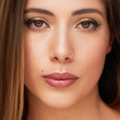 Natural beauty close up portrait of attractive Latina woman. The young beautiful brunette model  against grey background.