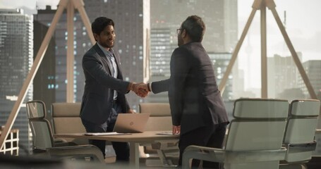 Aufkleber - South Asians Business Partners Striking a Successful Deal at a Corporate Modern Meeting Room. Two Young Indian Businessmen Shaking Hands After a Positive Negotiation Process