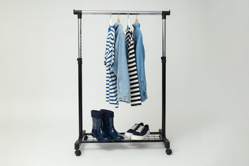 Wall Mural - Wardrobe rack with different clothes, concept of different clothes